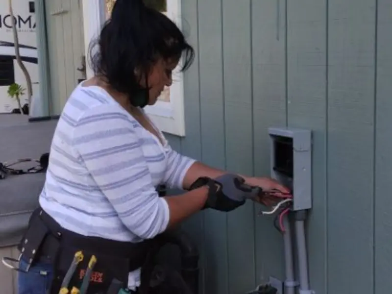 Licensed electrician wiring an exterior subpanel in Upper Yoder